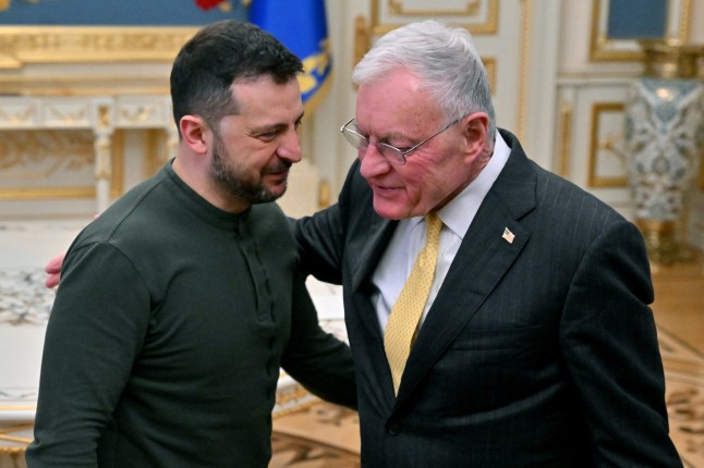 Ukraine's President Volodymyr Zelensky (L) greets US envoy Keith Kellogg at his offices in Kyiv on February 20, 2025, amid the Russian invasion of Ukraine. Zelensky meets with US envoy Kellogg after the US president branded the Ukrainian leader a "dictator" and said Russia "have the cards" in any talks to end the war. The United States has provided essential funding and arms to Ukraine, but the US president has rattled Kyiv and its European backers by opening talks with Moscow they fear could end the war on terms unacceptable to them. (Photo by Sergei SUPINSKY / AFP) (Photo by SERGEI SUPINSKY/AFP via Getty Images)