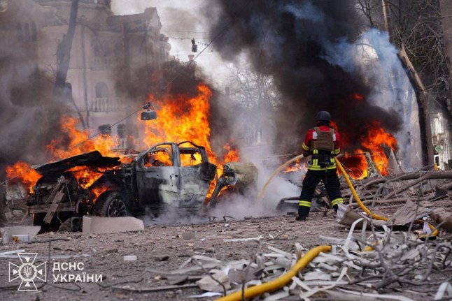 Firefighters work at the site of a Russian missile strike, amid Russia's attack on Ukraine, in central Sumy, Ukraine April 13, 2025. Press service of the State Emergency Service of Ukraine/Handout via REUTERS ATTENTION EDITORS - THIS IMAGE HAS BEEN SUPPLIED BY A THIRD PARTY. DO NOT OBSCURE LOGO.