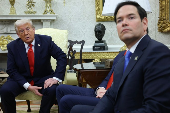 WASHINGTON, DC - APRIL 14: Secretary of State Marco Rubio sits nearby as U.S. President Donald Trump meets with President Nayib Bukele of El Salvador in the Oval Office of the White House on April 14, 2025 in Washington, DC. Trump and Bukele were expected to discuss a range of bilateral issues including the detention of Kilmar Armando Abrego Garcia, who has been held in a prison in El Salvador since March 15. (Photo by Win McNamee/Getty Images)