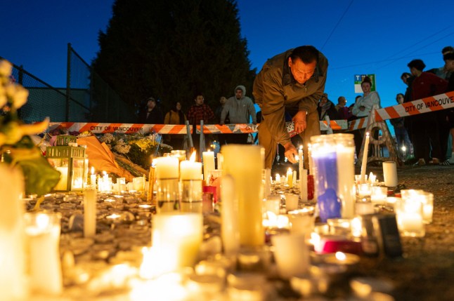 Mandatory Credit: Photo by Canadian Press/Shutterstock (15274786x) A man relights candles at a memorial site for the victims near the site of an attack where a vehicle was driven into a crowd at a street festival Saturday night in Vancouver, Sunday, April 27, 2025. Vcr-Festival-Gallery, Vancouver, Canada - 27 Apr 2025