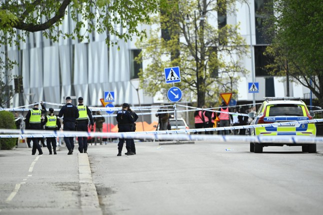 Police officers cordon off the scene after several people were killed in a shooting at Vaksala Square in central Uppsala, Sweden on April 29, 2025. (Photo by Fredrik SANDBERG / various sources / AFP) / Sweden OUT (Photo by FREDRIK SANDBERG/TT NEWS AGENCY/AFP via Getty Images)