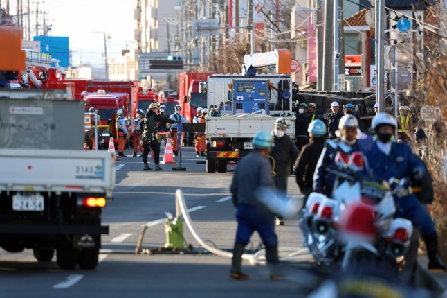 epa11862824 Rescue teams work at the site where a truck fell into a sinkhole, in Yashio, Saitama Prefecture, near Tokyo, Japan, 29 January 2025 (issued 30 January 2025). Emergency services are working to rescue a truck driver who fell into a sinkhole on 28 January 2025, but the operation has been hampered by the risk of further collapse. EPA/JIJI PRESS JAPAN OUT EDITORIAL USE ONLY/