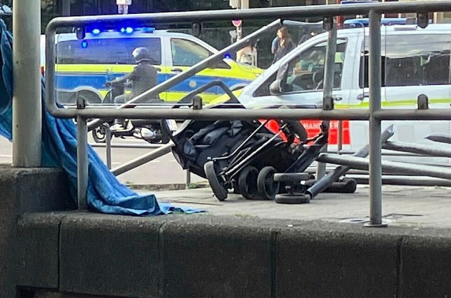 Emergency personnel work at the scene where a vehicle collided into a group of people in Stuttgart, Germany, on Friday, May 2, 2025. (Marco Krefting/dpa via AP)